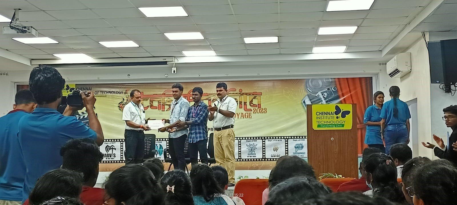 student receiving certificate for paper presentation